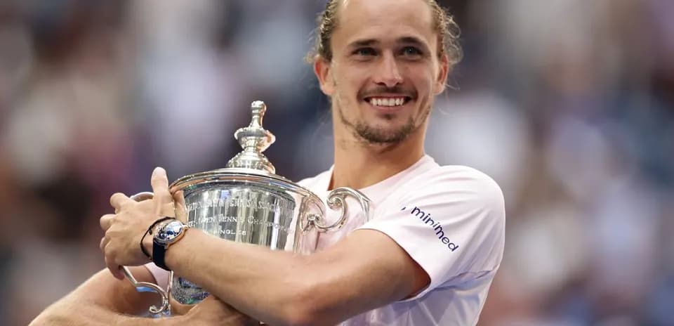 Player holding trophy after winning championship match