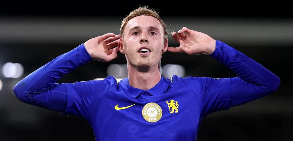 Player celebrating in Chelsea jersey during match
