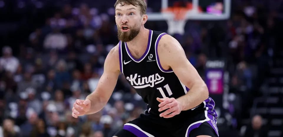 Player defending during a basketball game for Kings
