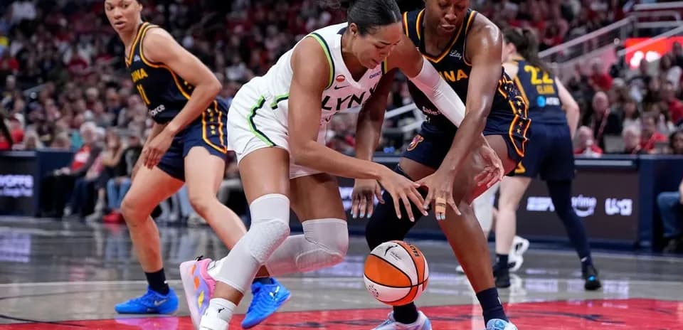 Players battling for the basketball on the court