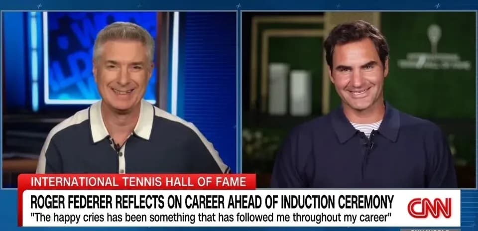 Two hosts discussing Roger Federer on CNN broadcast