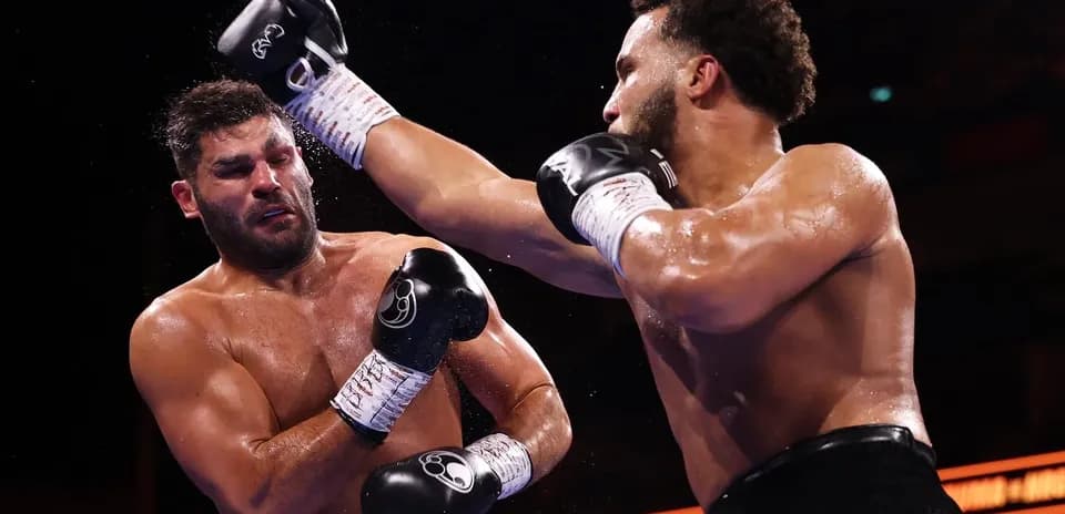 Boxers exchanging punches in a boxing match
