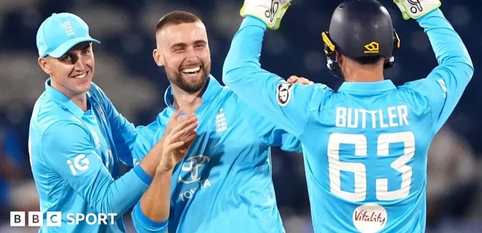 England players celebrating during a cricket match