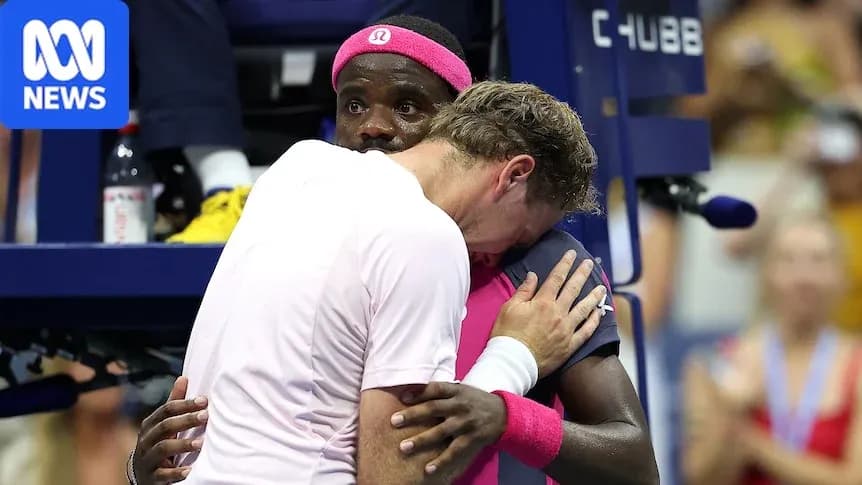 Two players embracing during a tennis match