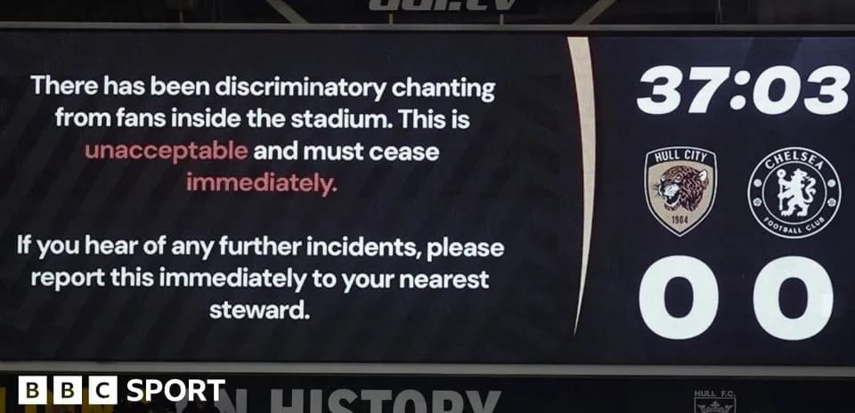 Stadium scoreboard displaying message about discriminatory chanting