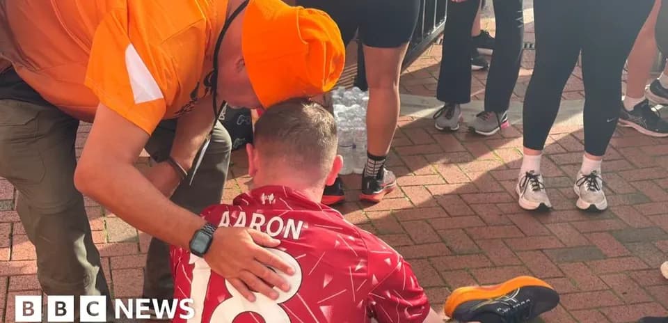 Runner receiving assistance after finishing a race