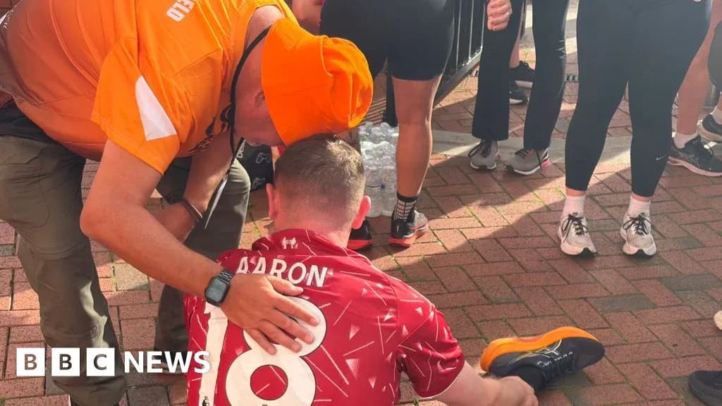 Runner receiving assistance after finishing a race