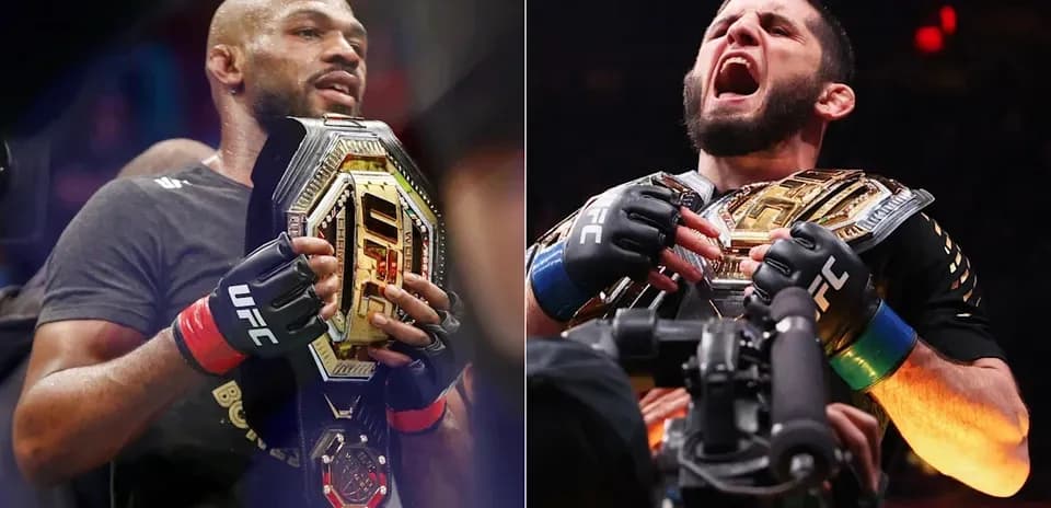 Two UFC champions holding their championship belts