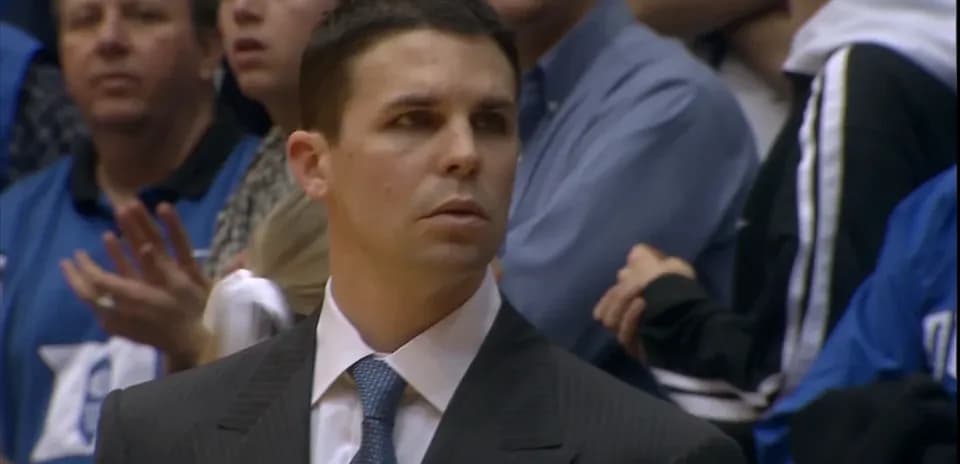 Coach observing the game from the sidelines