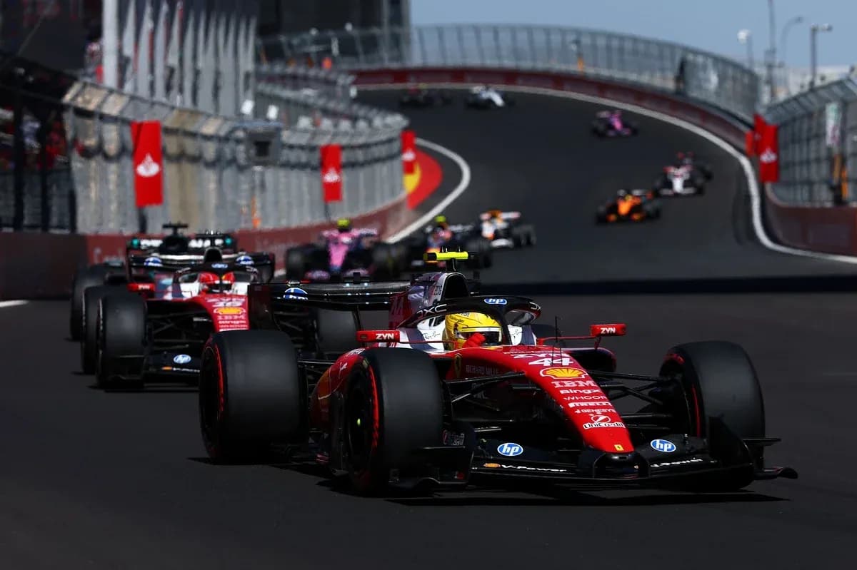 Ferrari car leading in Formula 1 race on track