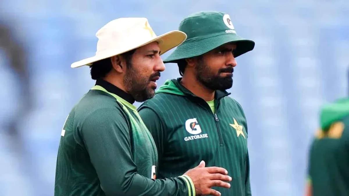 Two cricket players discussing during training session