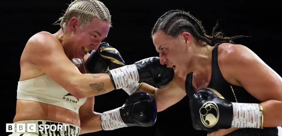 Two female boxers exchanging punches in the ring