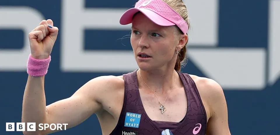 Tennis player celebrating with raised fist on court