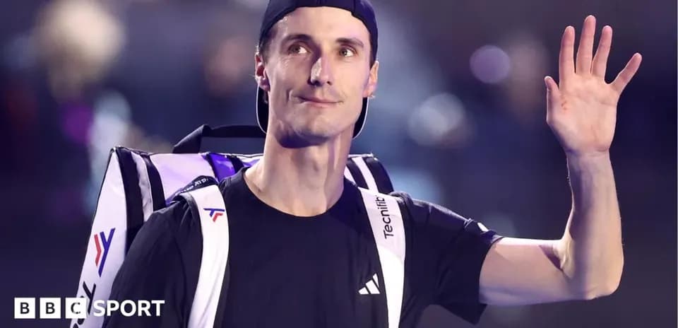 Tennis player waving while carrying backpack
