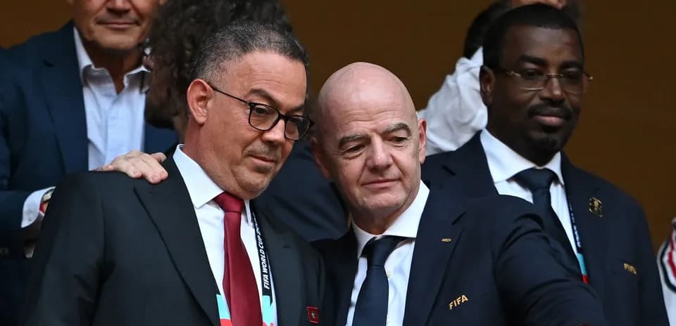 Two officials discussing during a football event