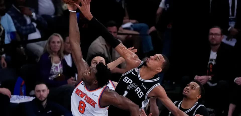 Player attempting a shot against defenders during game
