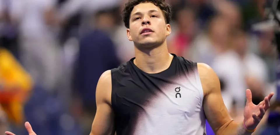 Tennis player reacting during a match