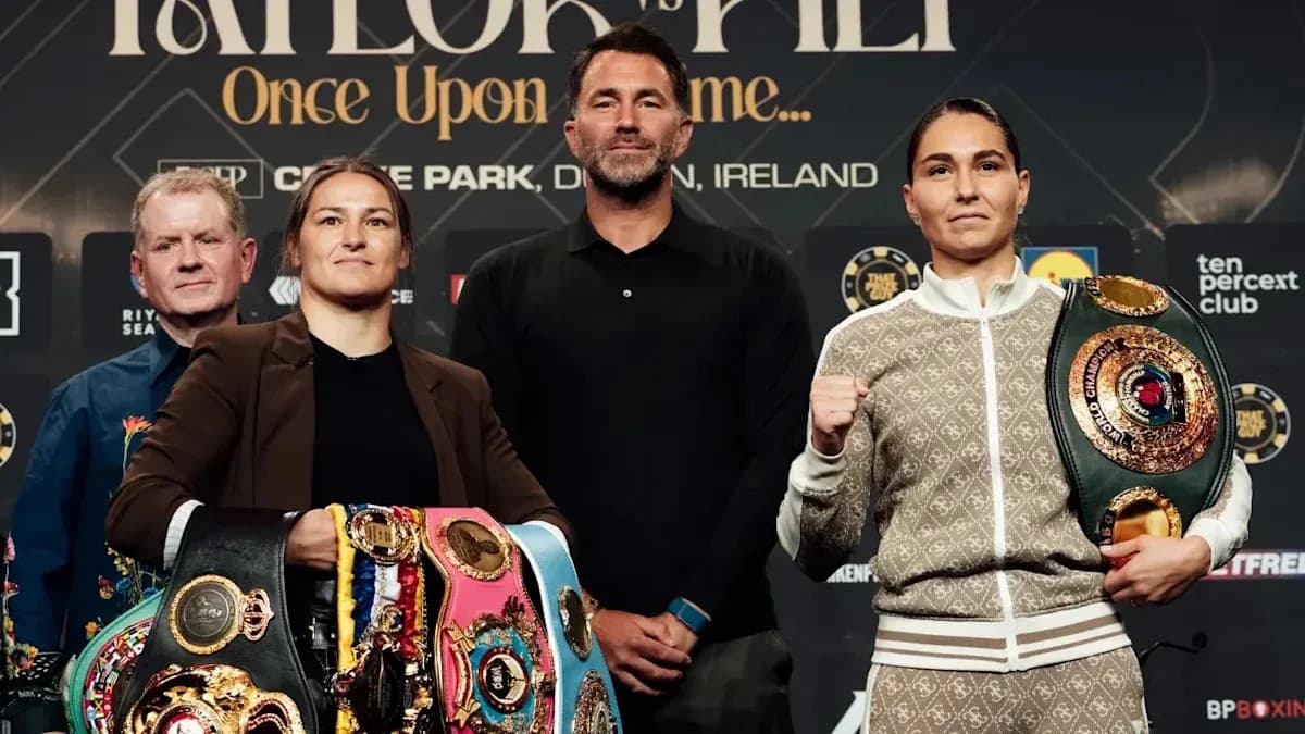 Two boxers with championship belts at press conference