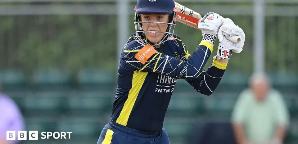 Cricketer preparing to bat during match