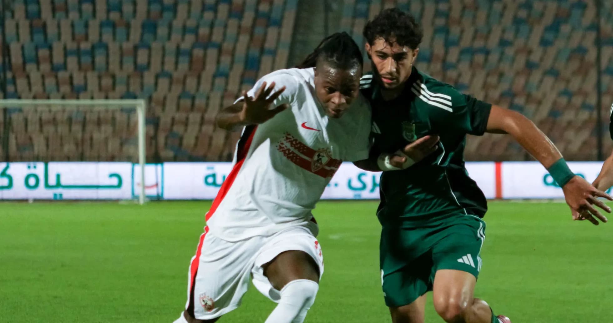 Two players competing for possession on the field