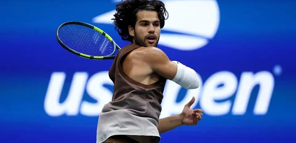 Player preparing to hit a backhand at US Open