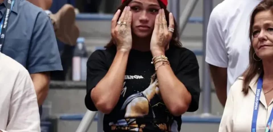 Spectators reacting during a tense moment at event