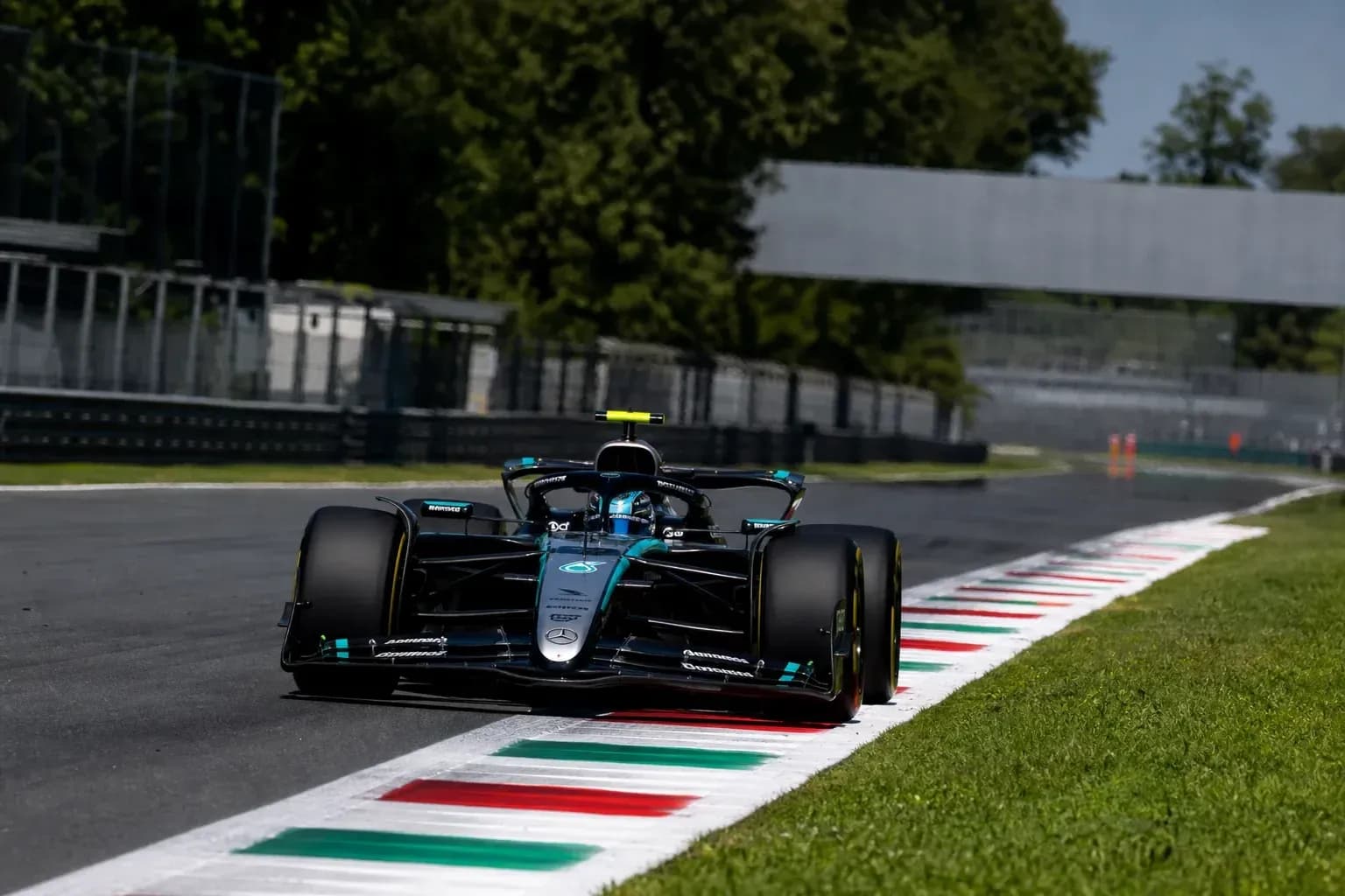 Formula 1 car navigating track at Monza