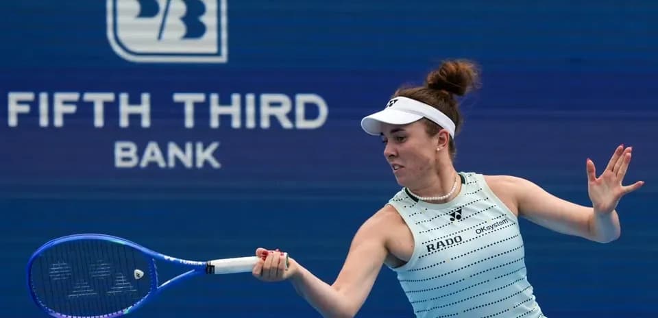 Player hitting a tennis ball during match
