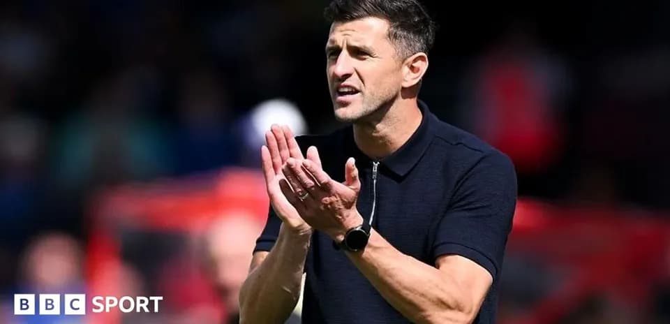 Coach gesturing during match on the sidelines