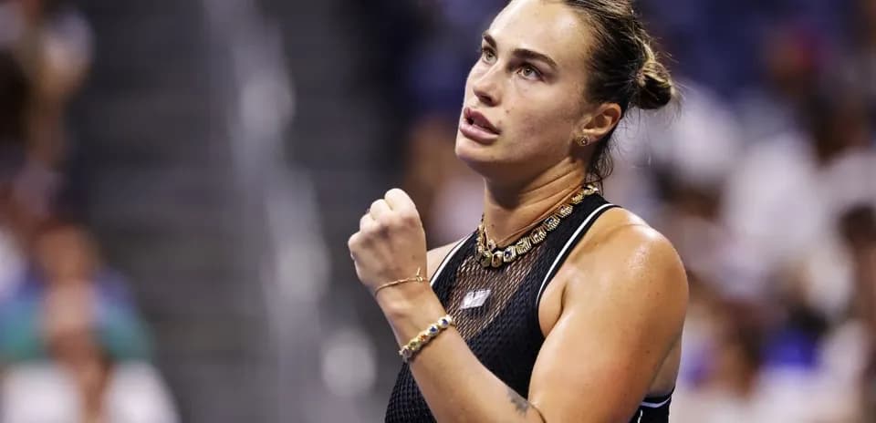 Tennis player celebrating a point during match