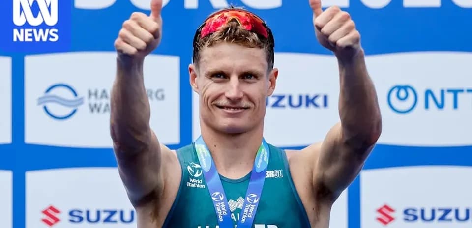 Athlete celebrating with thumbs up after event