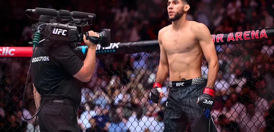 Fighter preparing for match inside UFC octagon