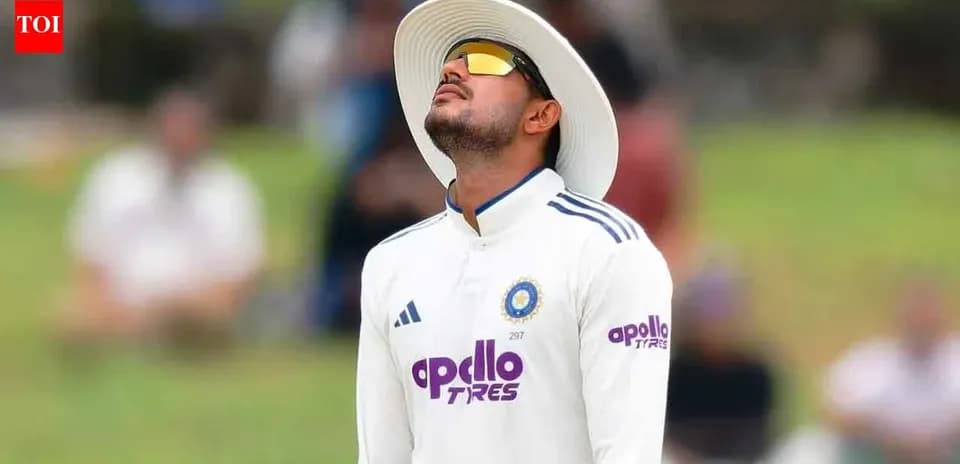 Cricketer looking up while fielding during match