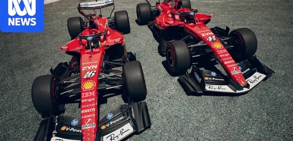 Two Ferrari Formula 1 cars on racetrack