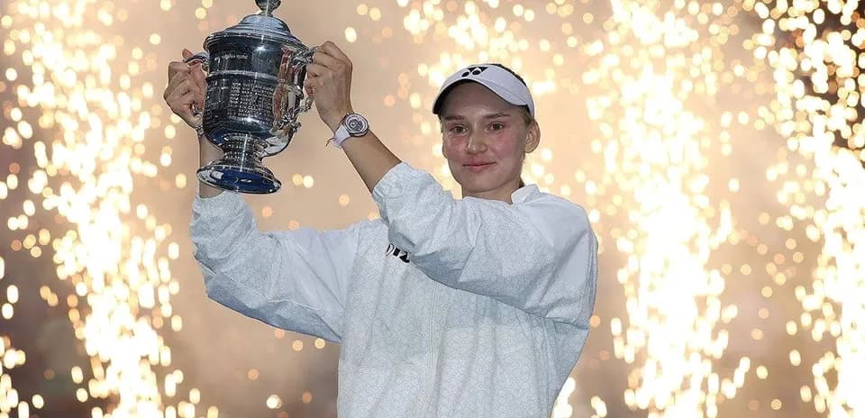 Player celebrating with trophy and fireworks background