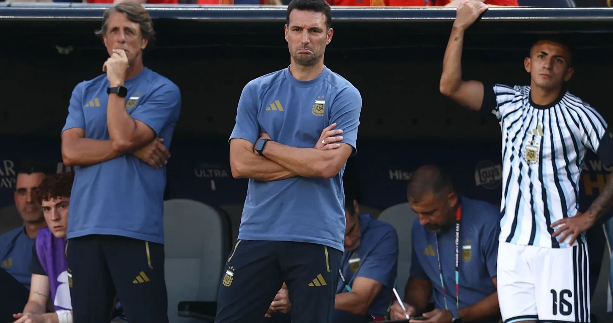 Coaches observing from the bench during a match