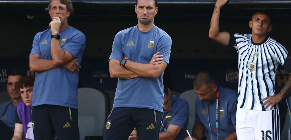 Coaches observing from the bench during a match
