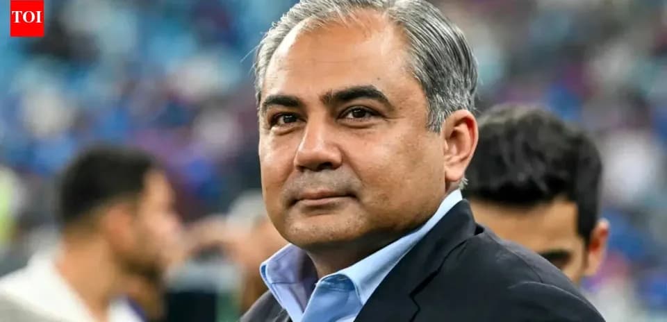 Man in suit at sporting event venue