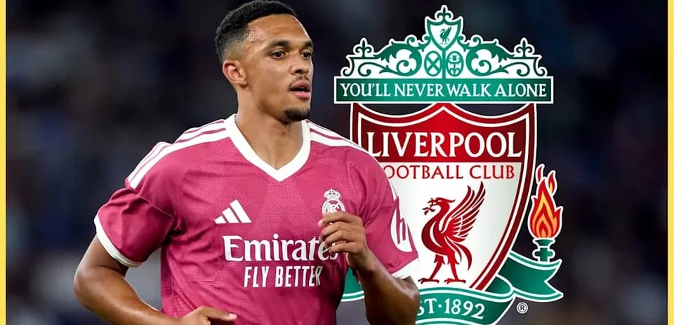 Player wearing Liverpool jersey with club logo background