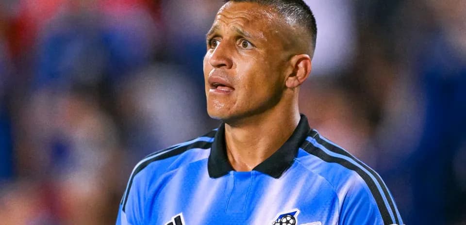 Referee in blue jersey during soccer match