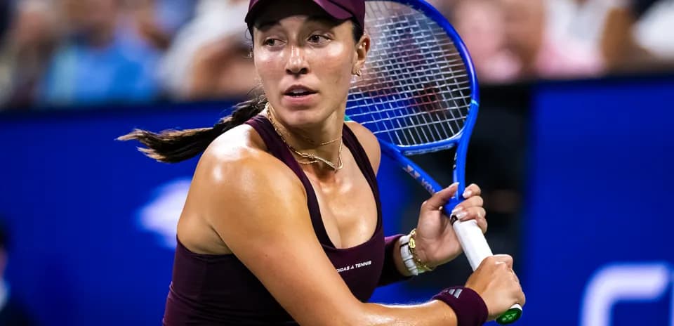 Female tennis player preparing to hit a shot