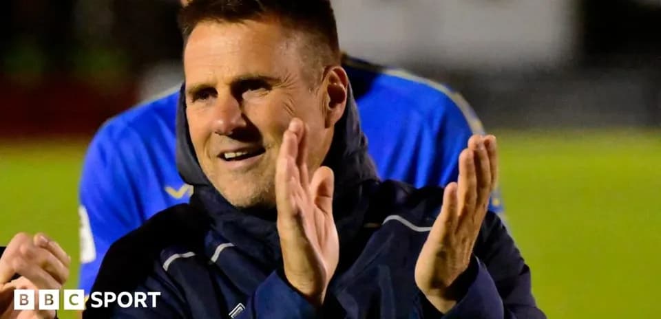 Coach clapping during a team celebration