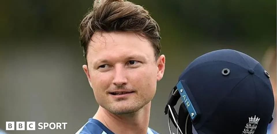 Cricketer holding helmet during practice session