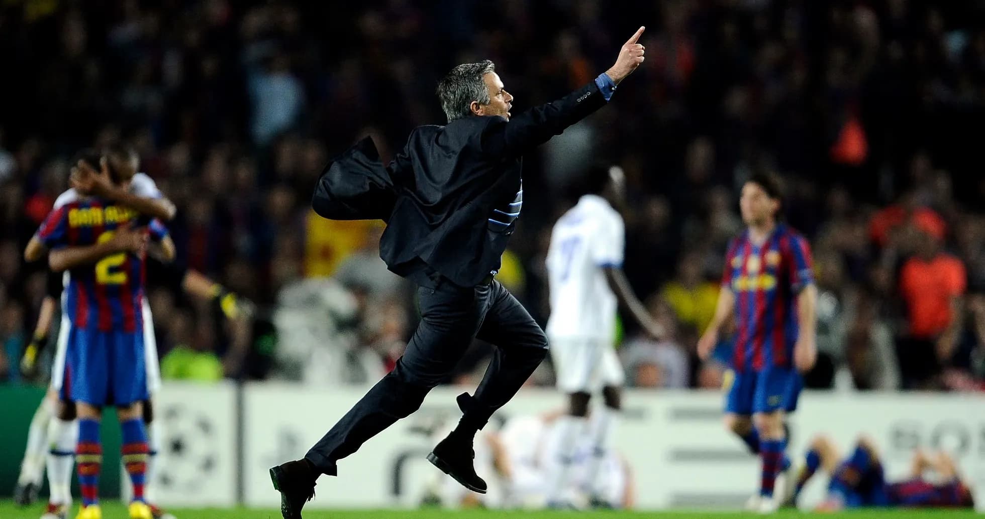 Coach celebrating a goal during intense match