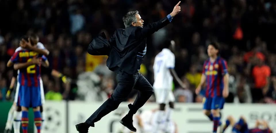Coach celebrating a goal during intense match
