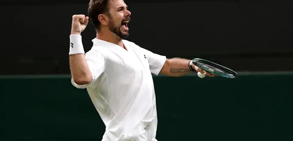 Tennis player celebrating a point on the court