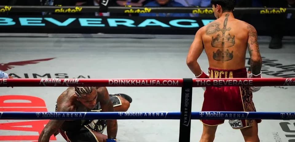 Boxer on canvas after being knocked down in match