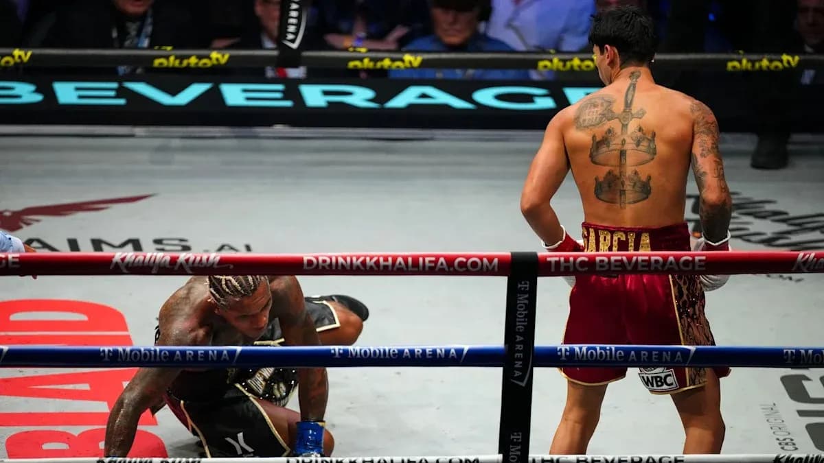 Boxer on canvas after being knocked down in match