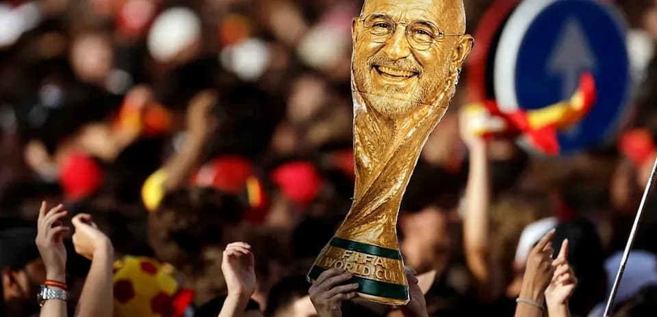 Fans celebrating with a FIFA World Cup trophy