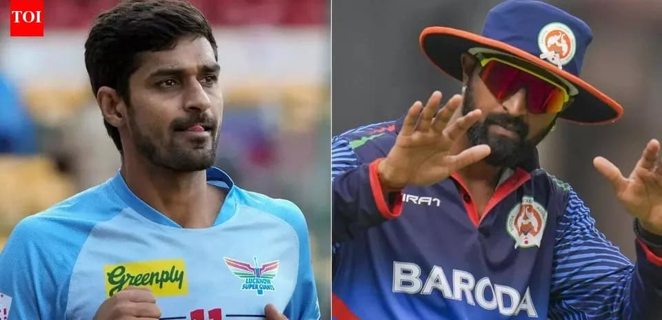 Two cricket players in team uniforms posing